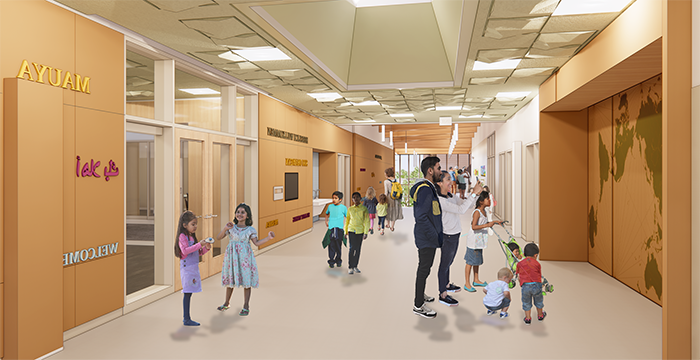 a hallway with people looking a map and going through glass doors