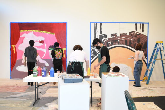 Group of high school students painting