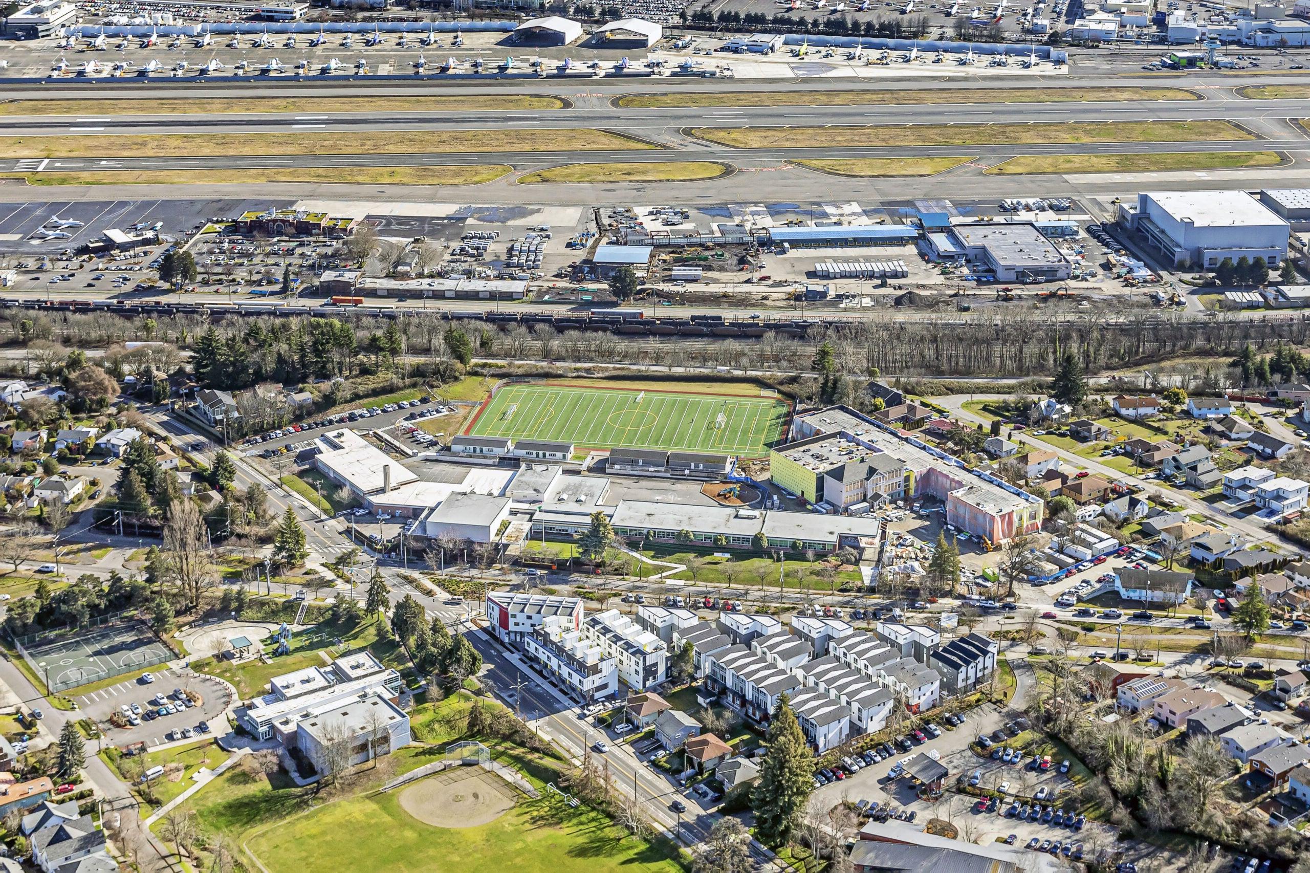 aerial of a long building with construction underway