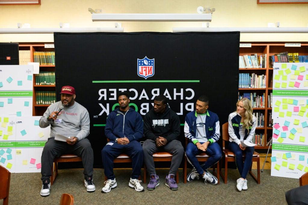 Panel of Seahawks players, dancers, and announcers